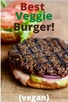 a hamburger sitting on top of a wooden cutting board