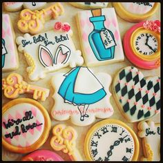 decorated cookies with different designs and words on them, including an image of a clock