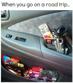 the inside of a car with snacks and candy in it