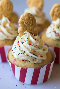 some cupcakes with frosting and sprinkles on them