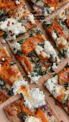 several slices of pizza with cheese, spinach and other toppings on a cutting board