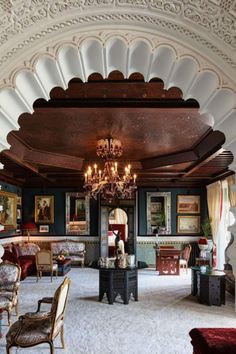 an ornately decorated living room with chandelier