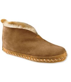 The bestselling women's Wicked Good Slippers are lined with genuine Australian lambswool, known for its ability to wick moisture and provide exceptional warmth and comfort. Half sizes order up. Spot clean. Sheepskin suede upper. Genuine shearling (lambswool) lining wicks moisture. Indoor leather sole. Imported. Fur Origin: Australia. | Women's Wicked Good Sheepskin Shearling Lined Slippers, Suede Leather/Sheepskin/Wool Slippers Brown, Best Slippers, Ugg Style, Shearling Slippers, Built To Last, Cozy Gift, Ski Trip, House Shoes, Ll Bean