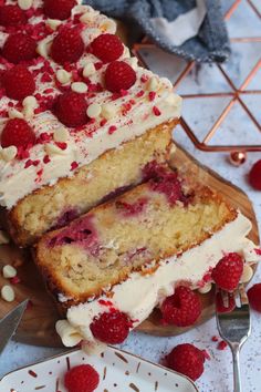 two slices of cake with raspberries and white frosting