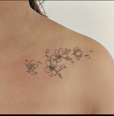 a woman's chest with flowers on it