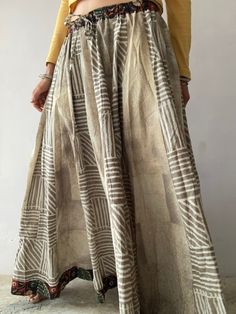 "This is beautiful traditional Indian style lehenga skirt Maxi loose and wide, frilled extra tall skirt  Super comfortable with natural look flared, made in soft cotton with block print patterns  full length with elastic waist  one of a kind  MEASURE Size M Waist 27-35\" Length 39\" MATERIAL *block print cotton *cotton inner lining  Thak You for looking" Bohemian Cotton Maxi Skirt With Full Shape, Bohemian Cotton Maxi Skirt For Festivals, Bohemian Cotton Lehenga With Block Print, Bohemian Long Skirt For Navratri, Bohemian Beige Flared Maxi Skirt, Beige Bohemian Flared Maxi Skirt, Bohemian Cotton Skirt With Batik Print, Beige Cotton Tiered Maxi Skirt, Summer Bohemian Long Skirt Lehenga