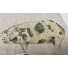 a black and white pig on a pillow