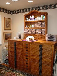 a large wooden cabinet sitting in the corner of a room