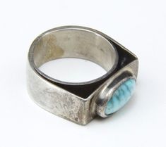 "Mid Century Modern Mens Turquoise Silver Ring -Artisan, modern design with a oblong turquoise stone -Appears to be hand made, unsigned -Ring is size 8.5 -Surface measures .8\" x .33\" -Turquoise stone measures 12mm x 7.5mm -Depth of the ring measures .28\" -Band width .34\" -Weight 9.6g In very good vintage condition, silver showing patina consistent with age. Ring has not been cleaned. A beautiful and highly collectible ring that can be worn everyday!" Mens Ring With Stone, Modern Turquoise Ring With Polished Finish, Modern Turquoise Ring, Jewelry Soldering, Cool Rings For Men, Vintage Silver Rings, Jewelry Design Inspiration, Ring Mens, Vintage Mid Century Modern