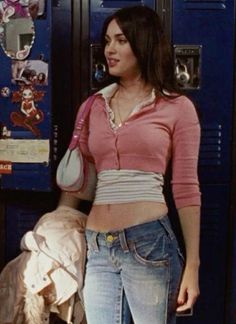 a woman standing in front of a locker