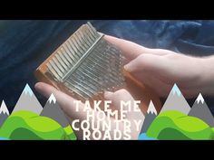 a person holding a comb in their hand with the words take me home country roads