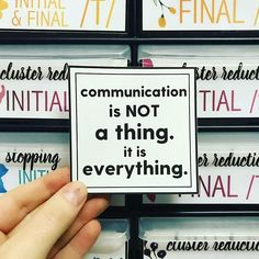 a person holding up a sign that says communication is not a thing, it's everything