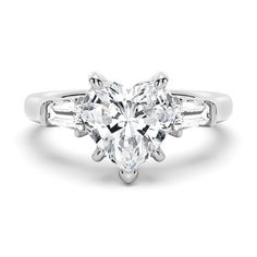 an oval cut diamond engagement ring with baguets