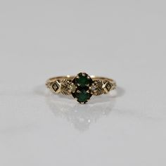 Exemplifying the charm of Victorian aesthetics, this exquisite ring is crafted from a captivating blend of 10K warm yellow/rose gold. Adorned with two lustrous green glass stones, reminiscent of the era's fascination with imitation gemstones, and accented by two delicate seed pearls, this ring exudes a unique and vintage-inspired elegance. A symbol of timeless beauty, it captures the essence of the Victorian era's romantic and ornate jewelry designs. Ring Size: 5.25 Metal Type: 10K Yellow/Rose Gold (Tested) Weight: 1.6g Hallmarks: None Engraving: None Width: 7.87mm Finger to Top of Ring: 3.54mm We look forward to providing you with an exceptional experience and helping you find more exquisite additions to your collection. *More Pictures Available on Request* R-1023CSP-N525 Victorian Wedding Rings, Victorian Aesthetics, Gay Jewelry, Jewelled Headpiece, Victorian Style Rings, Ornate Jewelry, Victorian Ring, Warm Yellow, Victorian Rings