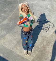 a young woman holding a pair of scissors in her hands