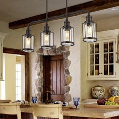 three lights hanging from the ceiling in a kitchen