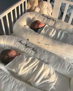 two babies are sleeping in their cribs