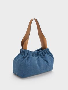 This large Ally bag offers practicality and versatility, while also standing out with its unique two-toned denim-and-brown colourway. The magnetic closure opens up to a spacious interior that will fit everything you need in a day, including a change of clothes for the gym. Carry it by the elegant curved top handle or simply clip on the detachable strap for hands-free convenience. Slouchy Bag, Practical Bag, Size Chart For Kids, Leather Denim, Charles Keith, Printables Kids, Belt Size, Denim Blue, Magnetic Closure