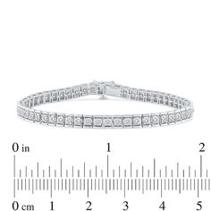 Be bold and bright in this certified lab-created diamond tennis bracelet. 10K white gold 1/10 ct. round certified lab-created diamonds line the rectangular-link bracelet F color/SI2 clarity with certification card 5 cts. t.w. of lab-created diamonds 8.5 inches; box clasp Channel Set Diamond Bracelet In Fine Jewelry Style, Fine Jewelry Diamond Bracelet With Channel Set, Diamond White Channel Set Diamond Bracelet, Fine Jewelry Diamond White Diamond Bracelet With Channel Set, Formal Diamond Tennis Bracelet Channel Set, Timeless Diamond Channel Set Tennis Bracelet, Channel Set Round Cut Diamond Bracelet, Anniversary Diamond Bracelet With Diamond Accents, Timeless Round Channel Set Bracelets