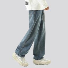 Introducing the must-have piece from our 2024 Spring Collection—the pebble-washed 90s jeans for men. These jeans embody the iconic style of the 90s with a modern twist, making them a perfect addition to your wardrobe. With distinctive features such as a baggy fit, pebble-washed finish, floor-length design, tall-waist, and drawstring closure, these jeans are the epitome of 90s fashion.90s Nostalgia with a Vogue FlairRelive the glory days of the Nineties with these stonewashed jeans. With a relaxe 90s Couture, Stonewashed Jeans, Fashion 90s, 90s Jeans, Glory Days, Jeans For Men, 90s Nostalgia, Iconic Style, Dark Blue Color