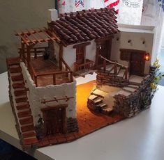 a model of a house made out of clay