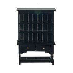 an old black bookcase with drawers on it