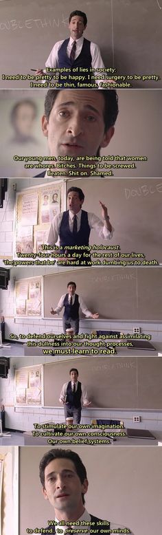 the man is standing in front of a blackboard with writing on it and pointing at something