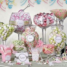 a table topped with lots of different types of candies and candy bar wrappers