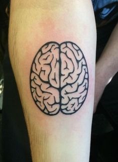 a person with a tattoo on their arm has a black and white image of a brain