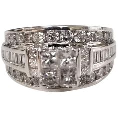 14k white gold invisible set diamond ring w/ princess, round and baguette cut diamonds, containing 50 diamonds weighing 1.20cts. diamond color "H" and clarity VS2-SI1, ring is a size 5.