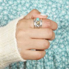 Fidget ring with Amazonite stone. Inspired by nature with cute flower and butterfly. Made of sterling silver, gold brass and genuine gemstone.*Our jewelry features natural, genuine gemstones, ensuring each piece is unique and one-of-a-kind. Please note that, as no two gemstones are identical, the jewelry you receive may vary from the photos.For wide-band rings, we recommend sizing up for the best fit.Material: Genuine Sterling Silver 92.5 Gemstone: Amazonite Gemstone size: 6x7mm Ring size: Choos Bohemian Sterling Silver Butterfly Ring, Bohemian Gold Stackable Sterling Silver Rings, Bohemian Gold Stackable Rings In Sterling Silver, Bohemian Gemstone Flower Ring As Gift, Bohemian Butterfly Ring For Gift, Bohemian Healing Birthstone Ring, Unique Turquoise Ring With Gemstone Accents, Unique Turquoise Ring With Gemstone Accents As Gift, Turquoise Ring With Gemstone Accents As Gift