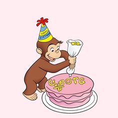 a monkey with a birthday hat on top of a cake