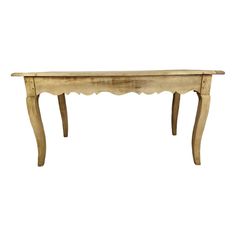 an old wooden table with scalloped legs and a long, narrow top on white background