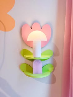 there is a toothbrush holder in the shape of a mushroom on top of a shelf