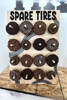 there is a sign with donuts on it that says spare tires in black letters