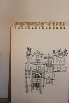 a drawing of an old building on paper