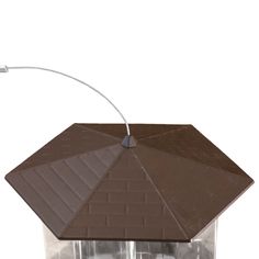 a bird feeder with two birds in it and an umbrella over the top for shade