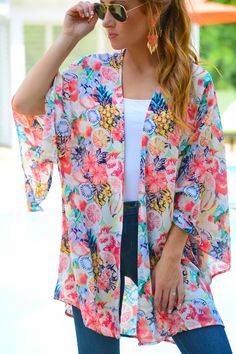 Sometimes your outfit just needs a little OOMPH! That's exactly what this airy kimono brings with its bright and bold tropical pattern! Tie it up or wear it long and loose - as you can see, it's great both ways! Printed Summer Cover-up For Day Out, Summer Patterned Kimono For Beach Cover-up, Casual Patterned Kimono For Beach Cover-up, Floral Print Open Front Cover-up For Vacation, Casual Spring Cover-up With Kimono Sleeves, Green Floral Print Summer Cover-up, Multicolor Print Kimono For Spring Beach Cover-up, Casual Tropical Print Cover-up For Spring, Pink Floral Print Kimono For Beach Cover-up