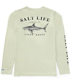 a white long sleeved shirt with a shark on the front and words that say salt life