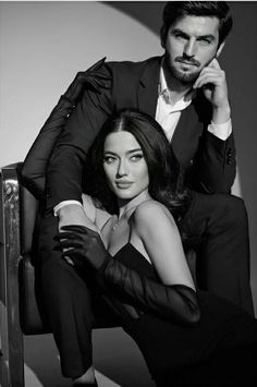 a man and woman posing for a black and white photo