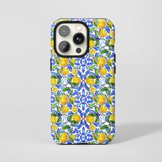 an iphone case with yellow lemons and blue tiles on it's back cover