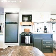 a kitchen with an oven, microwave and refrigerator