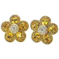 Cellini's iconic Flower Power earrings . These stunning earrings are composed with five pear shaped yellow sapphires ,with a round brilliant diamond center. Each petal and center are surrounded with micro pave. The Flower measures approximately 3/4" in diameter. Yellow Sapphire s, 6.25ct. and White diamonds .50cts. The earrings have collapsible post backs for pierced and non pierced wearers. These earrings are stamped CELLINI and 750. Appraisal upon request Flower Earring, Ear Candy, Antique Earrings, Stunning Earrings, Yellow Sapphire, Modern Earrings, Contemporary Jewelry, Brilliant Diamond, Gold Flowers