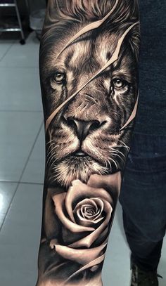 a man with a lion and rose tattoo on his arm