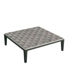 a coffee table with a grey and white pattern on it's top, sitting in front of a white background