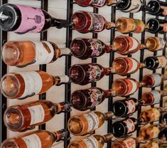 a wine rack filled with lots of bottles