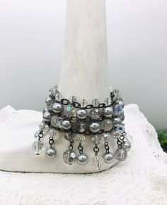 Stunning bracelet  5 layers  Shimmering grey and clear beads 6" length item# P23094 Gently loved Thank you for visiting our shop! Gray Beaded Multi-strand Jewelry, Wedding Bracelets, Clear Beads, Wedding Jewelry Bracelets, Vintage Bracelet, Pearl Grey, Vintage Bracelets, Wedding Bracelet, Wedding Jewelry