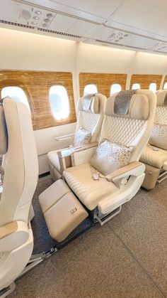 the inside of an airplane with leather seats