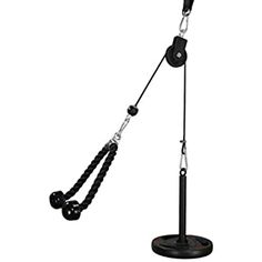 a black and white photo of a microphone on a stand with a cord attached to it