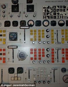 the control panel is full of different gauges and dials for various types of instruments